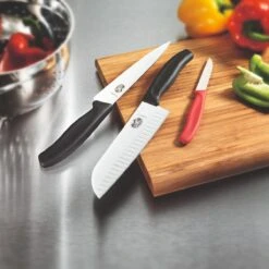 Victorinox Swiss Classic 17cm Santoku Knife Fluted Blade Orange (6852617L9B) -KITCHEN KNIVES Shop cut 6 8523 17 b1 1 santoku ls3 1 2